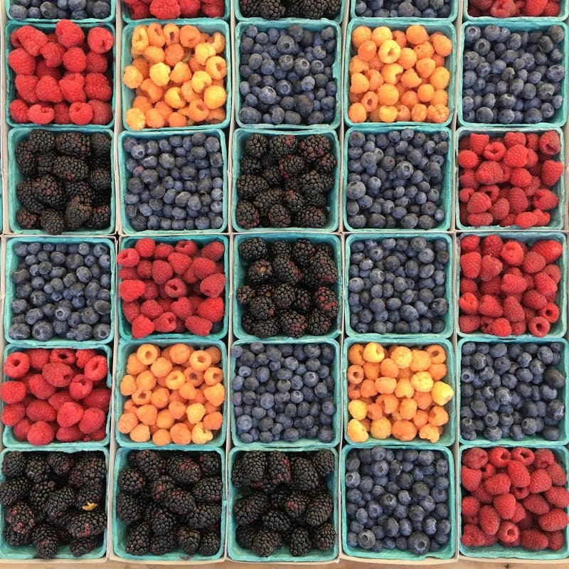 Boxes of strawberries, raspberries, blueberries and blackberries